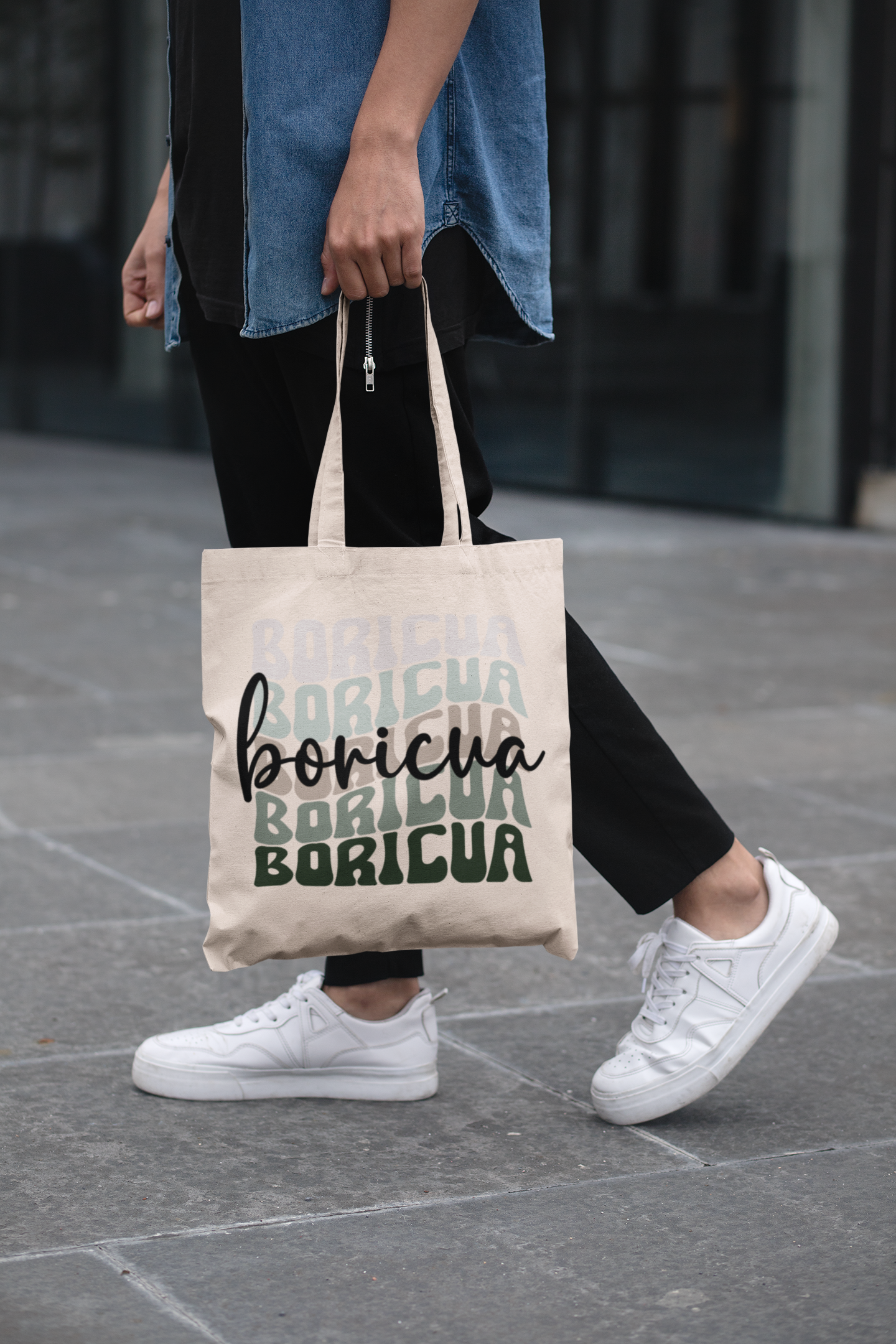 cropped-face-mockup-of-a-man-holding-a-tote-bag-in-the-street-29424