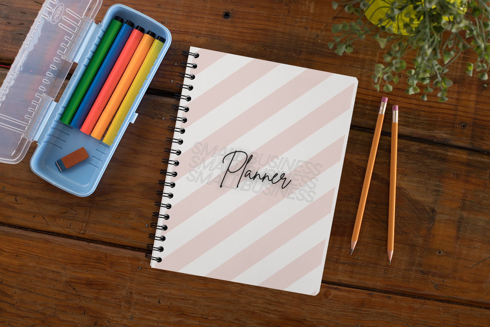 mockup-of-a-spiral-notebook-over-a-wooden-surface-29960